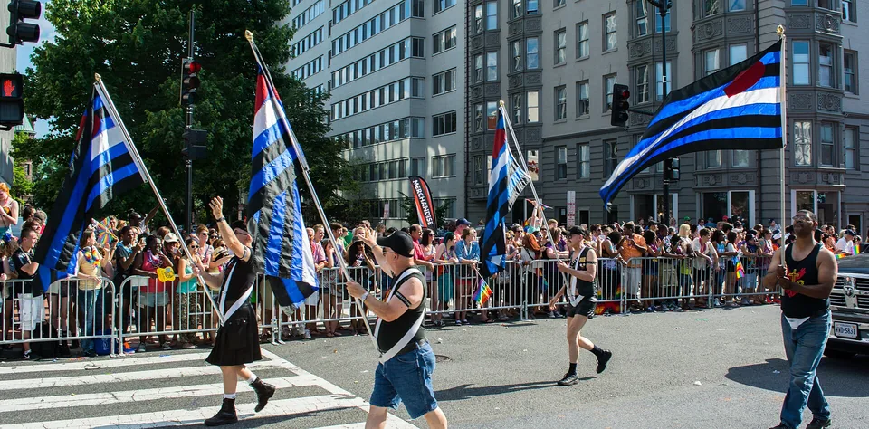 Leather and BDSM community members carry leather pride flags at DC Capital Pride in 2014