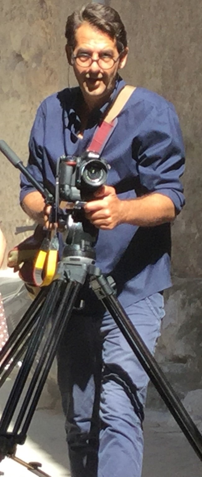 Nikos Zappas behind a video camera
